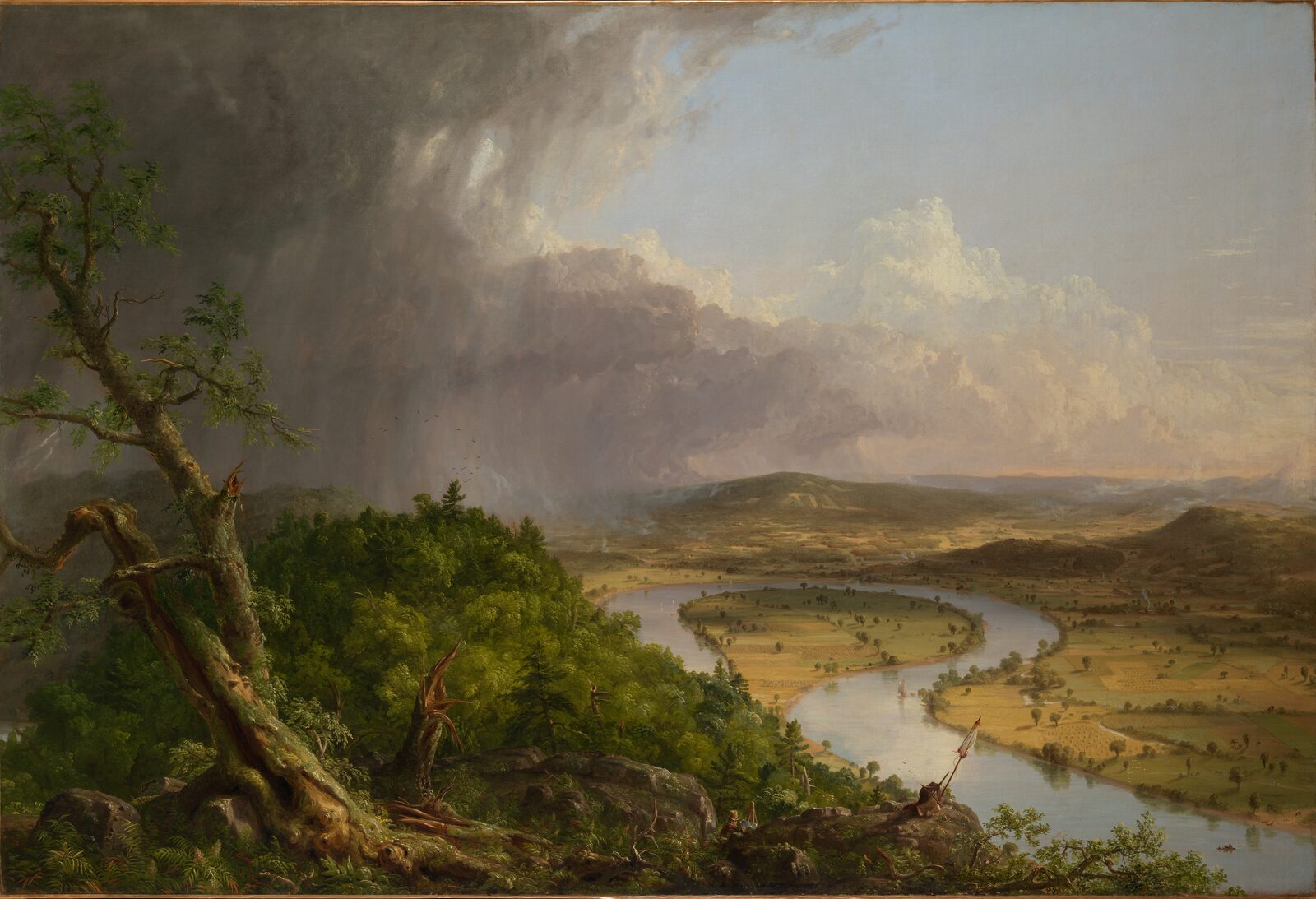 A thunderstorm passing over forest on the left and farmland round a bend of the Connecticut River on the right